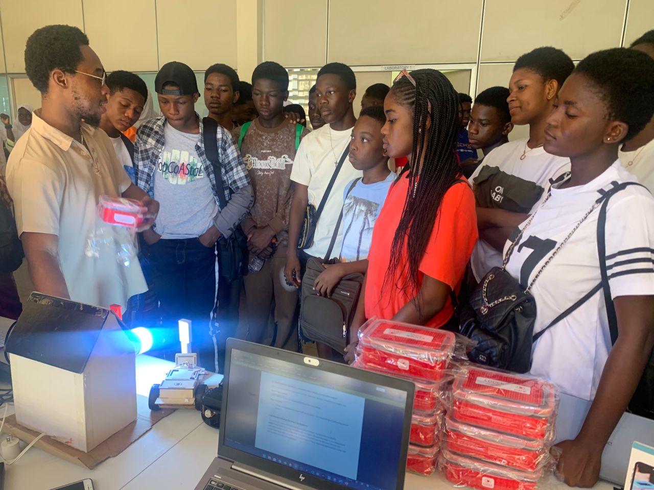 Students observing a robotics demonstration