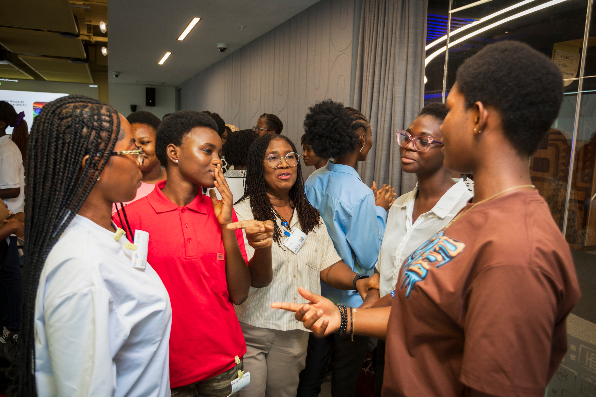 Mentor engaging students during a robotics workshop