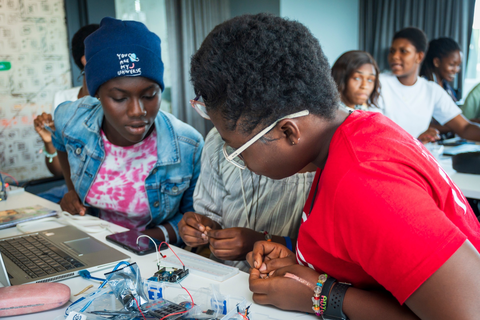 Students prototyping circuits together in a workshop