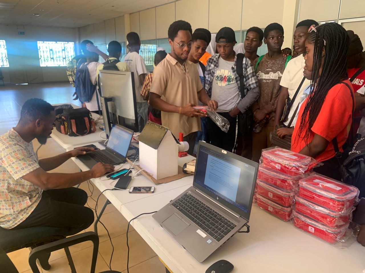 Students being introduced to programming kits at a STEM exhibition