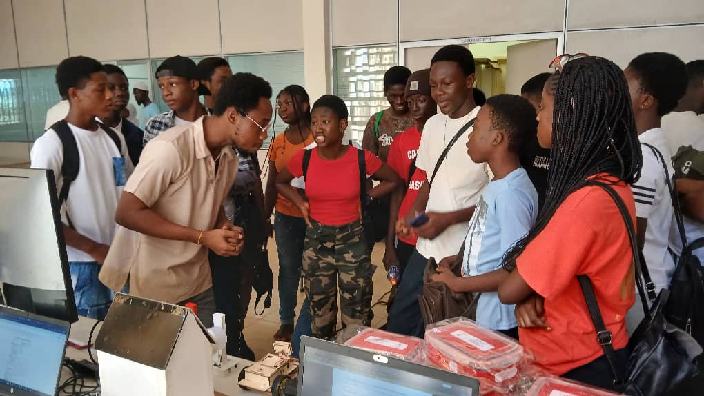 Students engaging with a facilitator at a STEM showcase