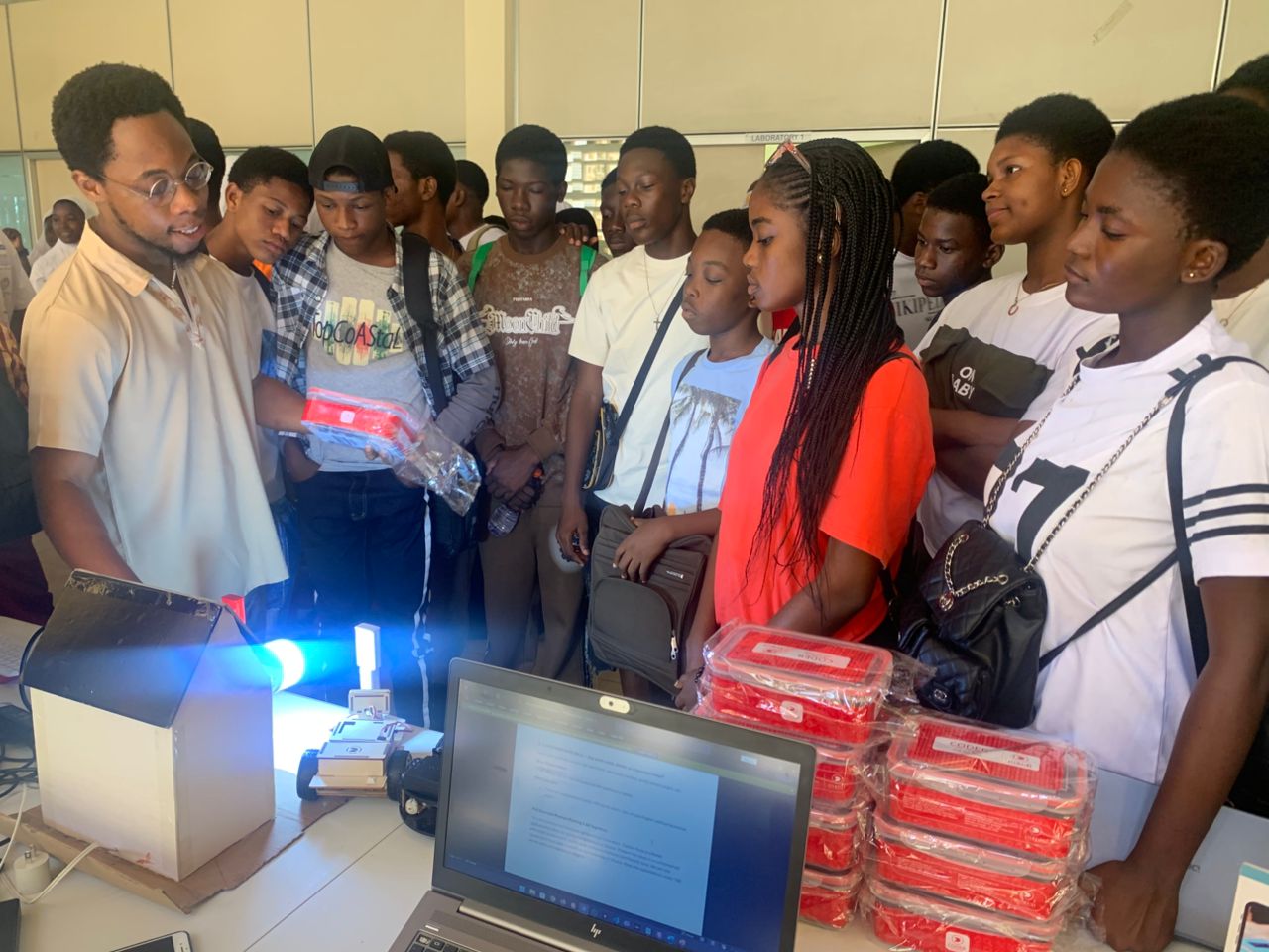 Students learning about an Arduino kit on display